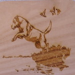 A dog jumping over water on top of a wooden board.